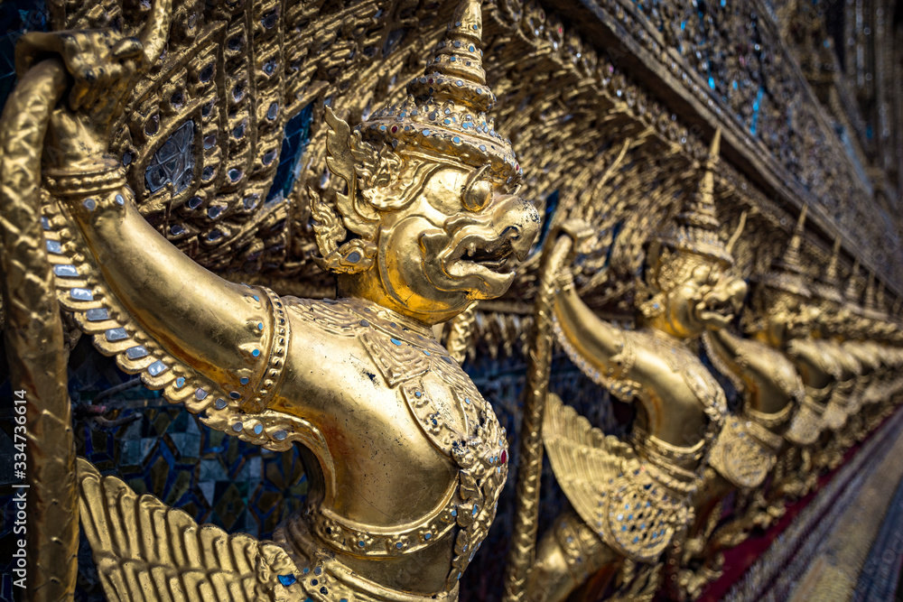 Golden Garuda statues at Wat Phra Kaew, inside the Grand Palace Complex, in Bangkok, Thailand.
