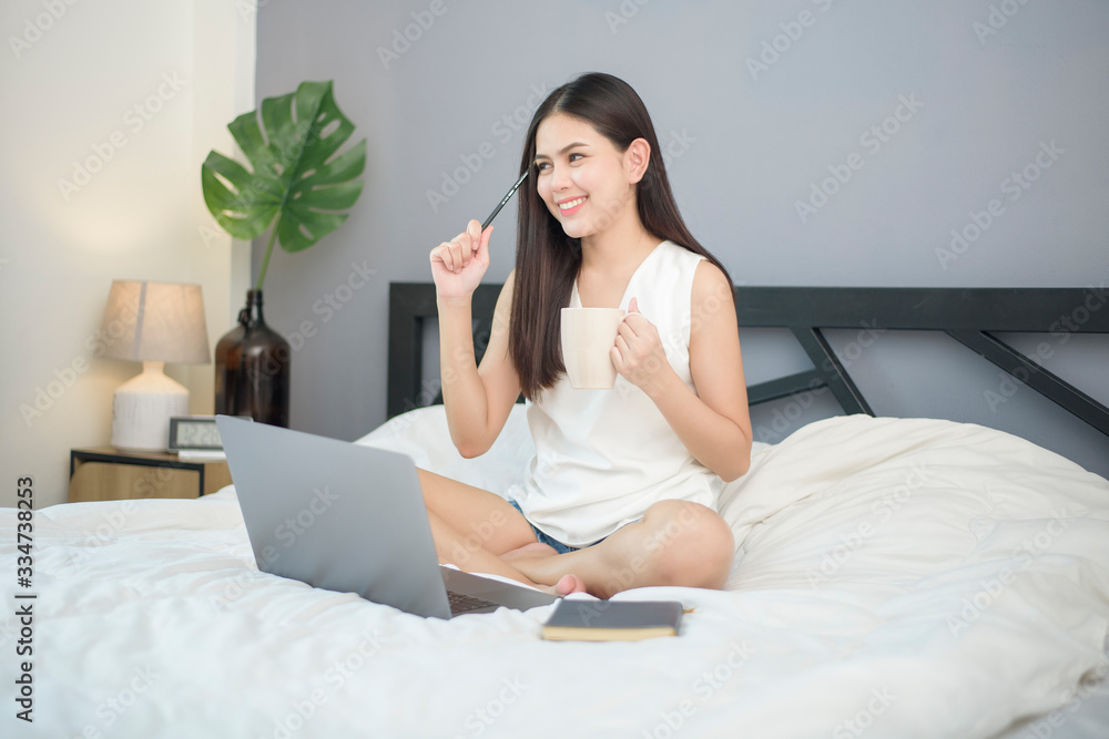 Beautiful woman is working from home