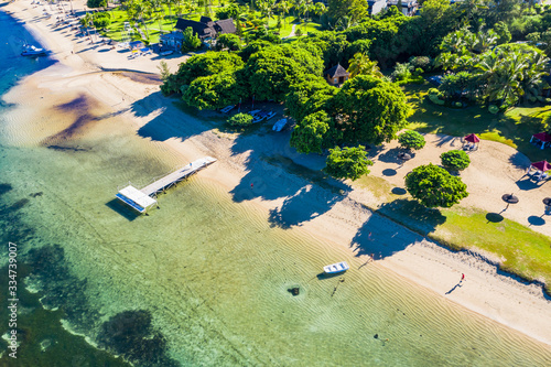 The beach at Flic en Flac with luxury hotel Sofitel Mauritius L'Impérial Resort & Spa and palm trees, Mauritius, Africa