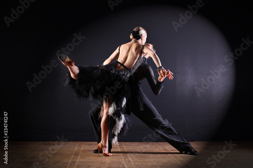 Fototapeta Naklejka Na Ścianę i Meble -  Dancers in ballroom isolated on black background