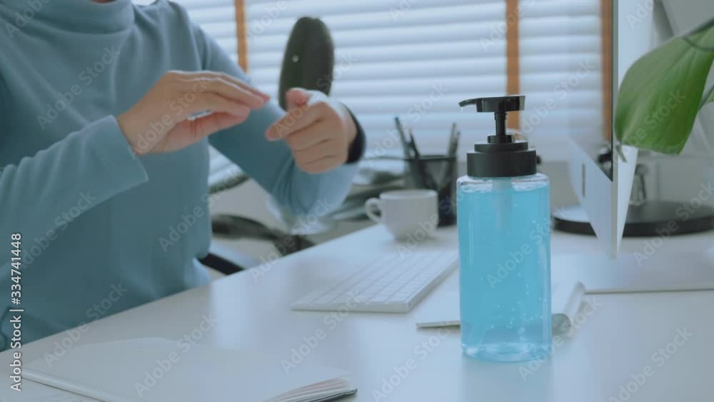 Woman hands using alcohol gel clean wash hand sanitizer anti virus bacteria and working from home Woman hands using alcohol gel clean wash hand sanitizer anti virus bacteria and working from home