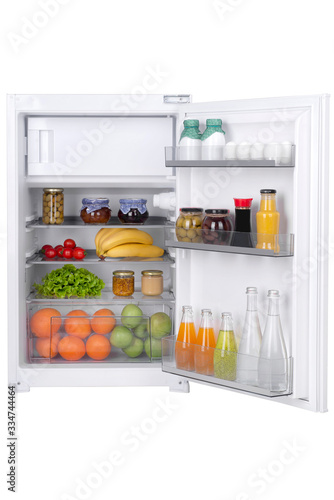 Open fridge full of fresh fruits and vegetables