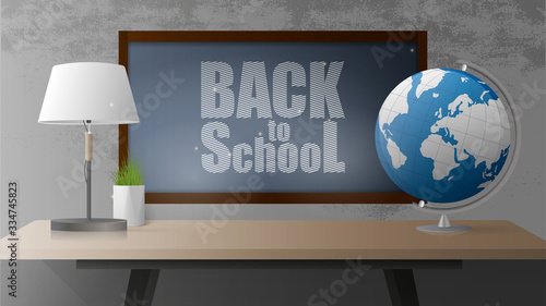 Back to school banner. Black board, wooden table in the loft style, a globe, a table lamp, a pot of grass, a gray concrete wall. Vector illustration