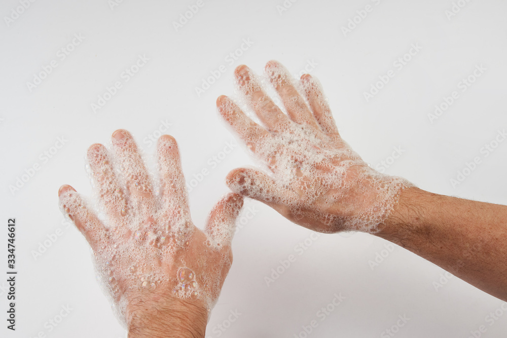 Man washing dirty hands with soap, close-up Man washing dirty hands with soap, close-up