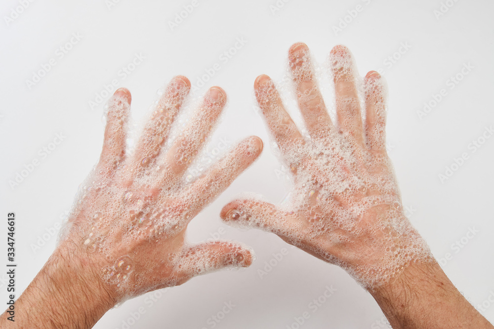 Man washing dirty hands with soap, close-up Man washing dirty hands with soap, close-up