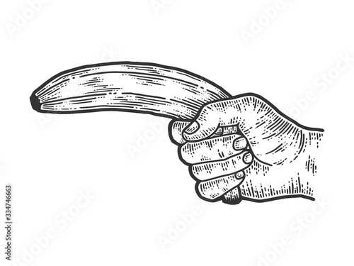 Male hand shoots a banana. Sketch scratch board imitation.