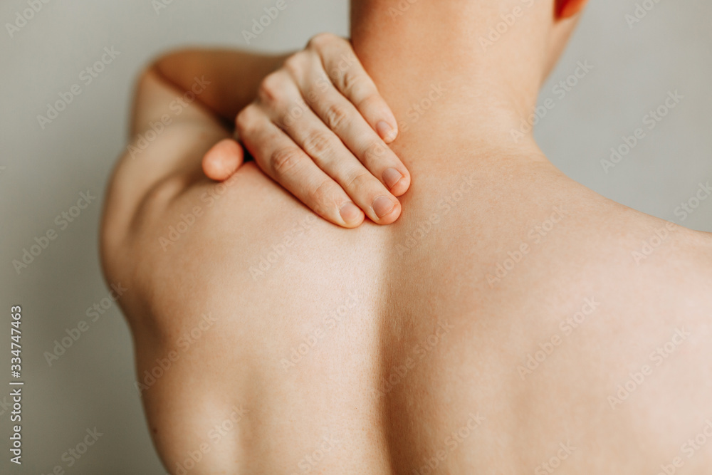 Injuries to the spine and lower back, fatigue at work. Area of the injury, the image on a clean background. Spasm on the man's back. Injuries to the spine and lower back, fatigue at work. Area of the injury, the image on a clean background. Spasm on the man's back.