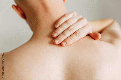 Injuries to the spine and lower back, fatigue at work. Area of the injury, the image on a clean background. Spasm on the man's back.