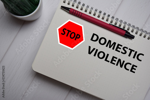 Stop Violence Domestic write on a book isolated on Office Desk.