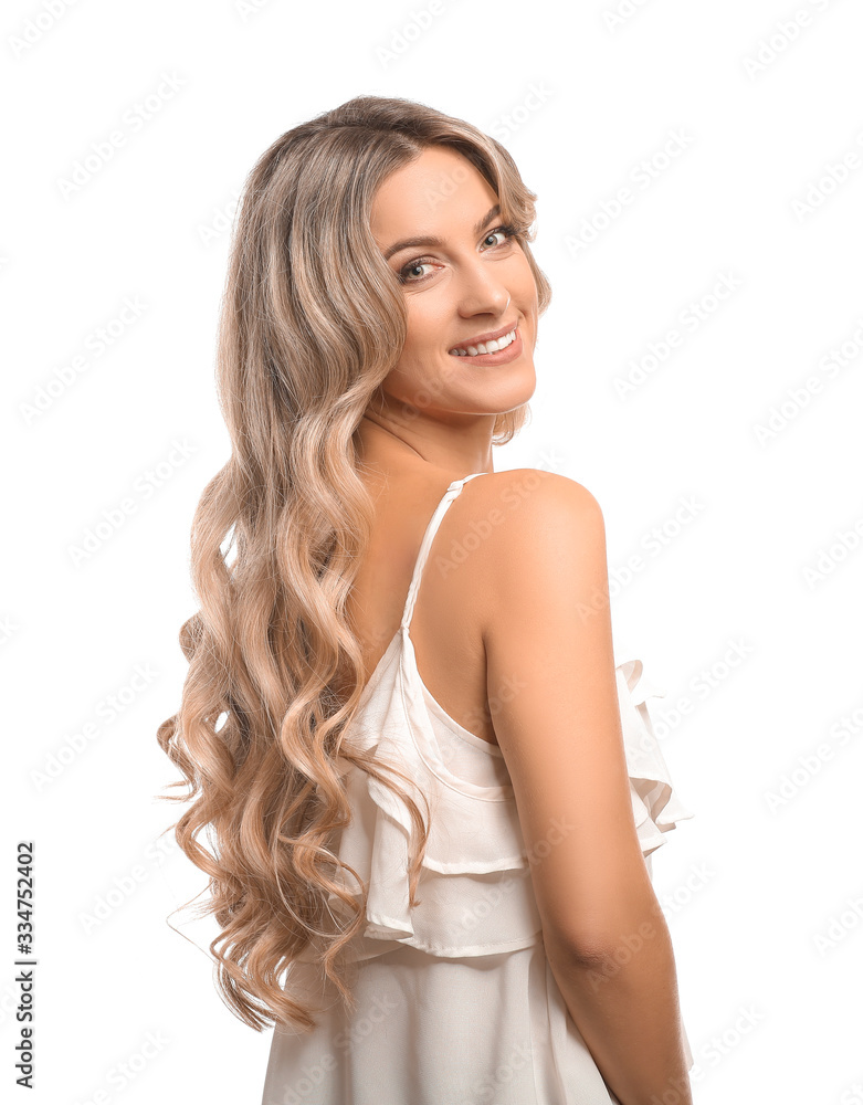 Obraz premium Beautiful young woman with curly hair on white background