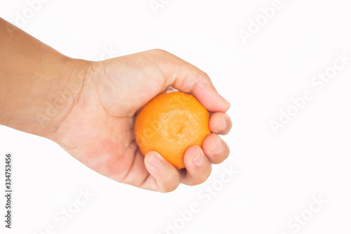 Close up orange fruit in hand.