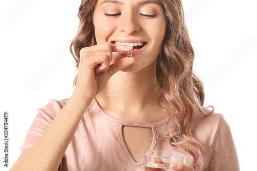 Young woman with fish oil o...