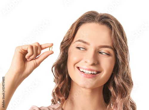 Young woman with fish oil o...