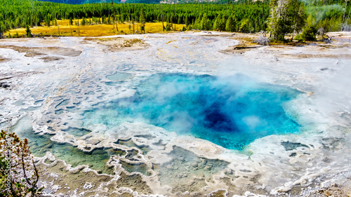 Steam coming from the turquoise waters of the Artemisia Geyser hot spring in the Upper Geyser Basin along the Continental Divide Trail in Yellowstone National Park  Wyoming  United States