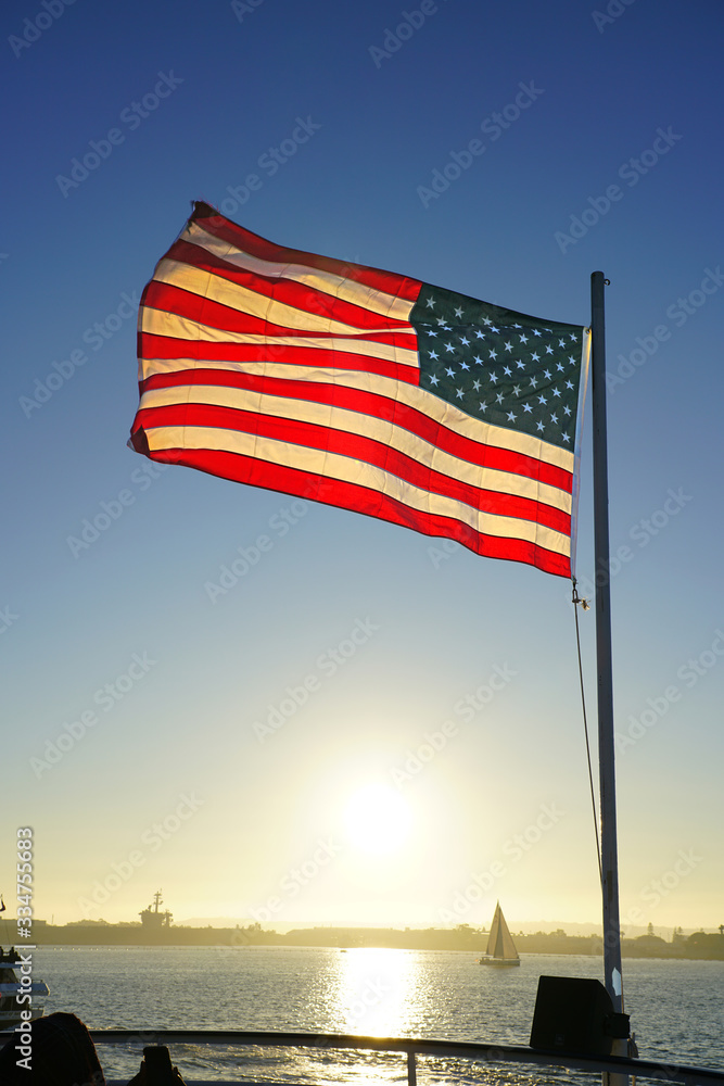 American flag of the United States of America floating on a mast