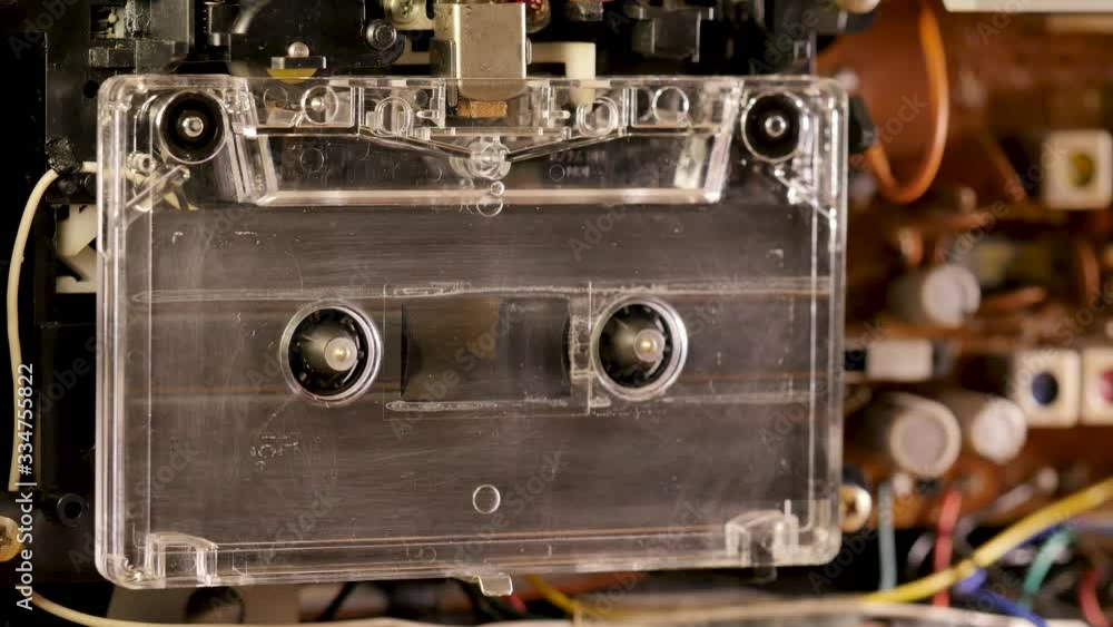 Cassette Tape playing in open tape recorder Cassette Tape playing in open tape recorder