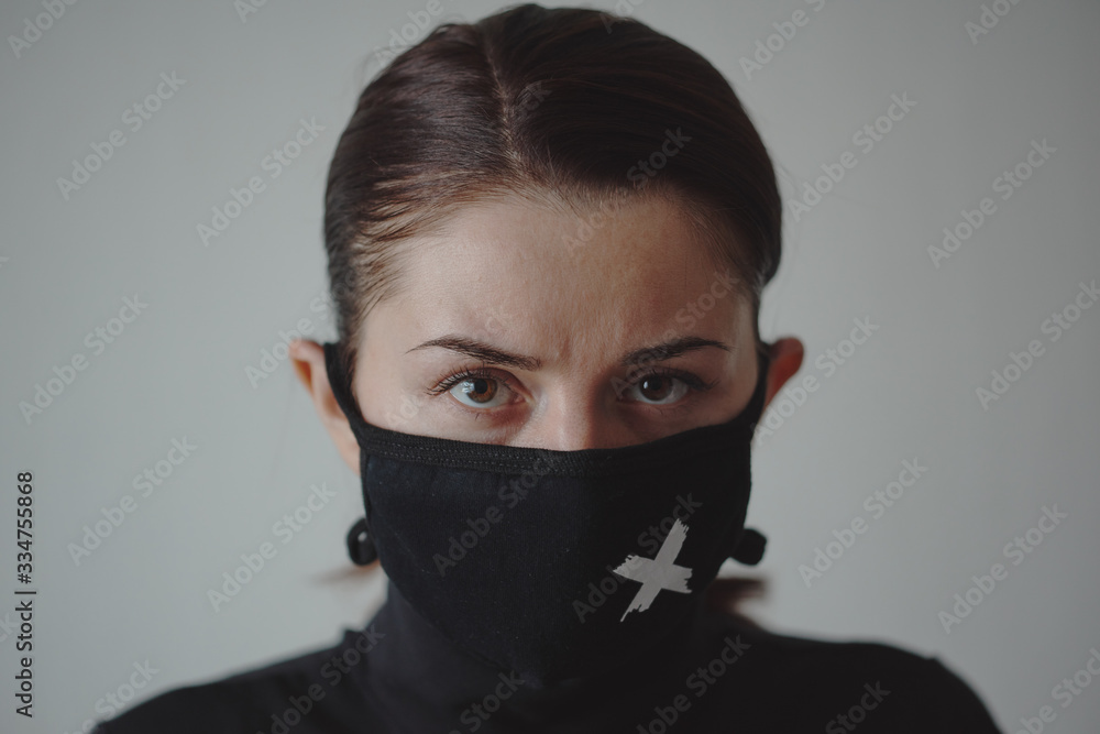 Girl in a black mask against viruses and flu Girl in a black mask against viruses and flu