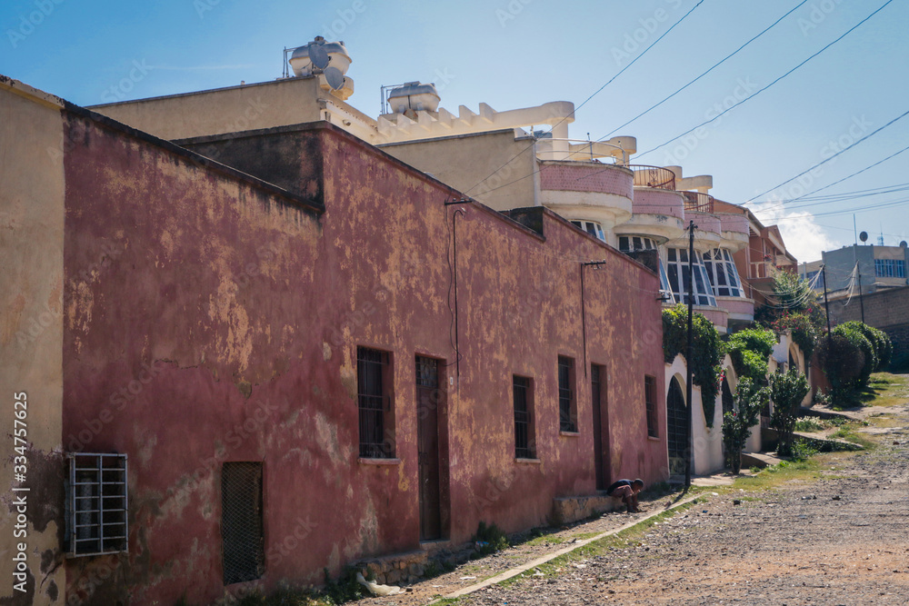 Asmara, Eritrea - November 01, 2019:  Old Buildings and Cars around of Local Market