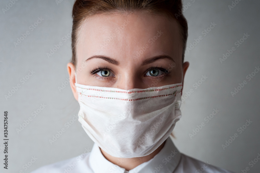 Portrait of a girl in a medical mask. Close up..