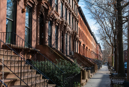 A Row of Old Colorful Brownstone Townhouses in Fort Greene Brooklyn New York photo