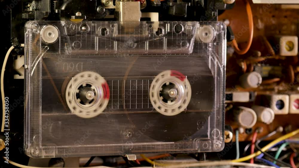 Cassette Tape playing in open tape recorder Cassette Tape playing in open tape recorder