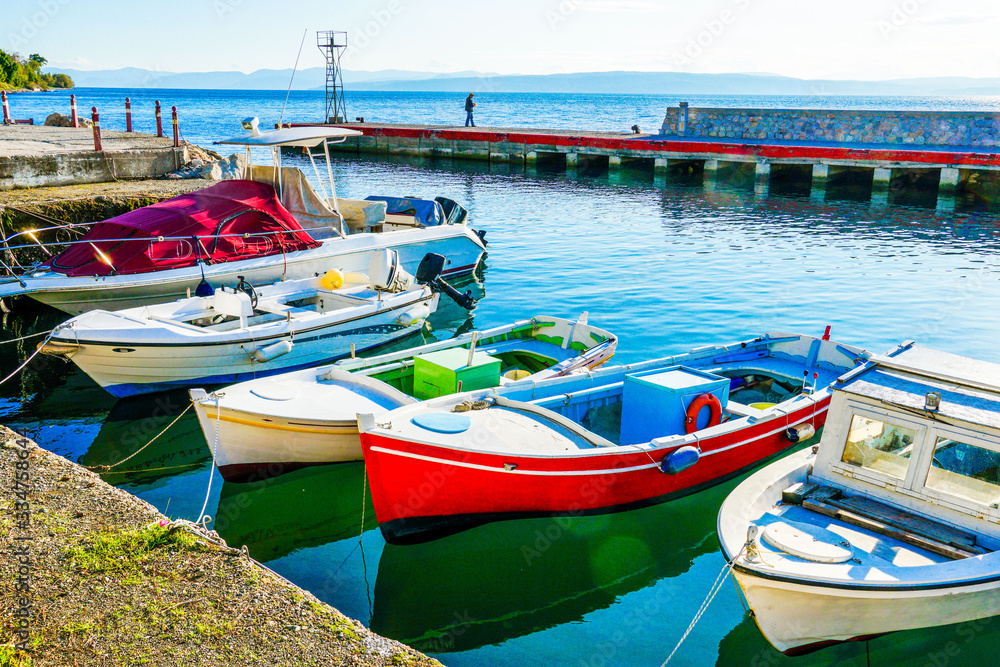 Colorful fishing boats docked at the harbour in Greece