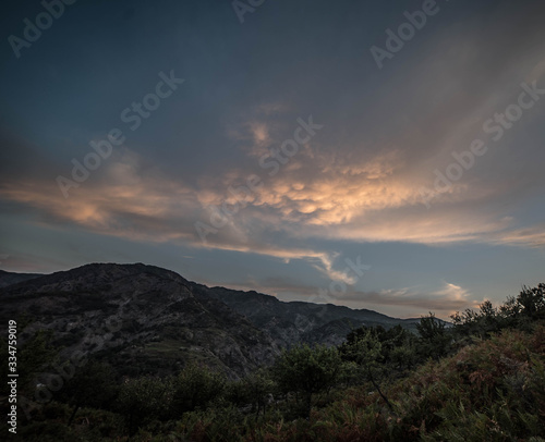 sunset in the desert waiting for the starry sky with hills in summer