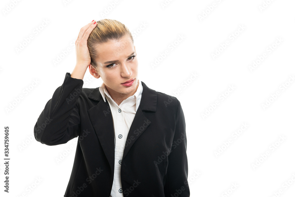 Young female assistant manager holding head like hurting Young female assistant manager holding head like hurting