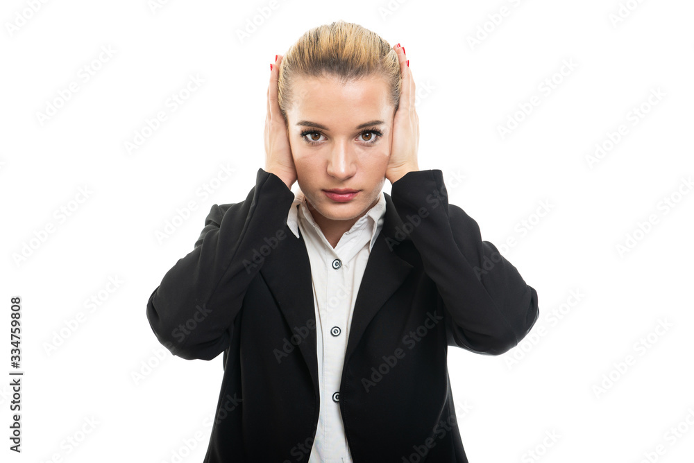 Young female assistant manager covering ears like deaf gesture Young female assistant manager covering ears like deaf gesture
