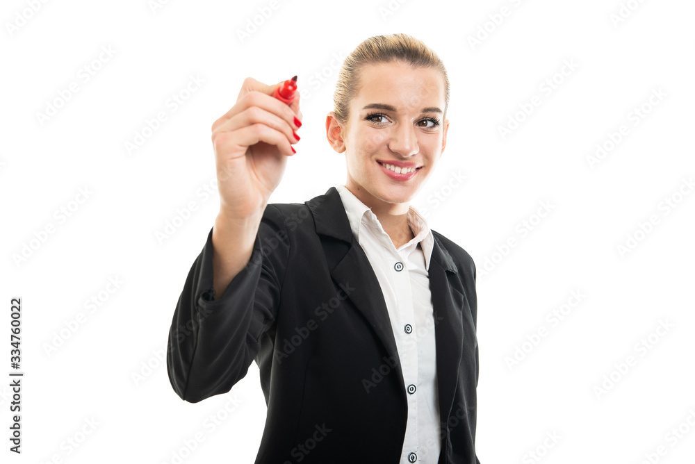 Young female assistant manager writing with red marker Young female assistant manager writing with red marker