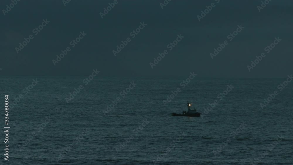 Coastal fishing boat in swell