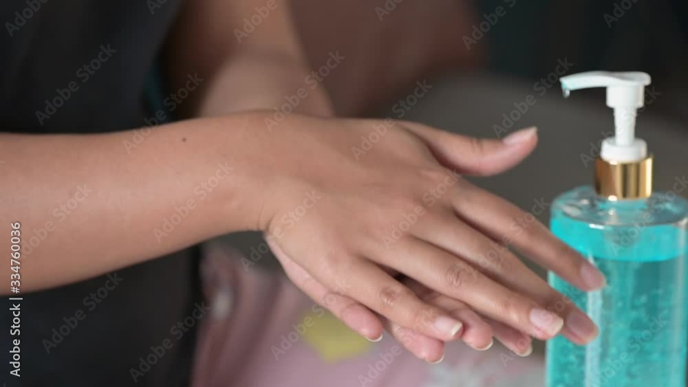 woman washing her hands with alcohol sanitizer gel for protecting infection from a Covid-19 virus and other viruses. woman washing her hands with alcohol sanitizer gel for protecting infection from a Covid-19 virus and other viruses.