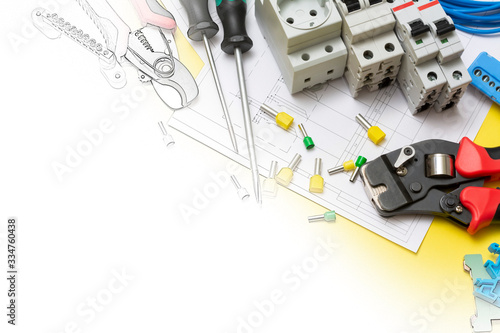 Crimping tools, electric safety machines and power tools on a yellow background. Electrician tools, the Concept of converting a color image to a drawing