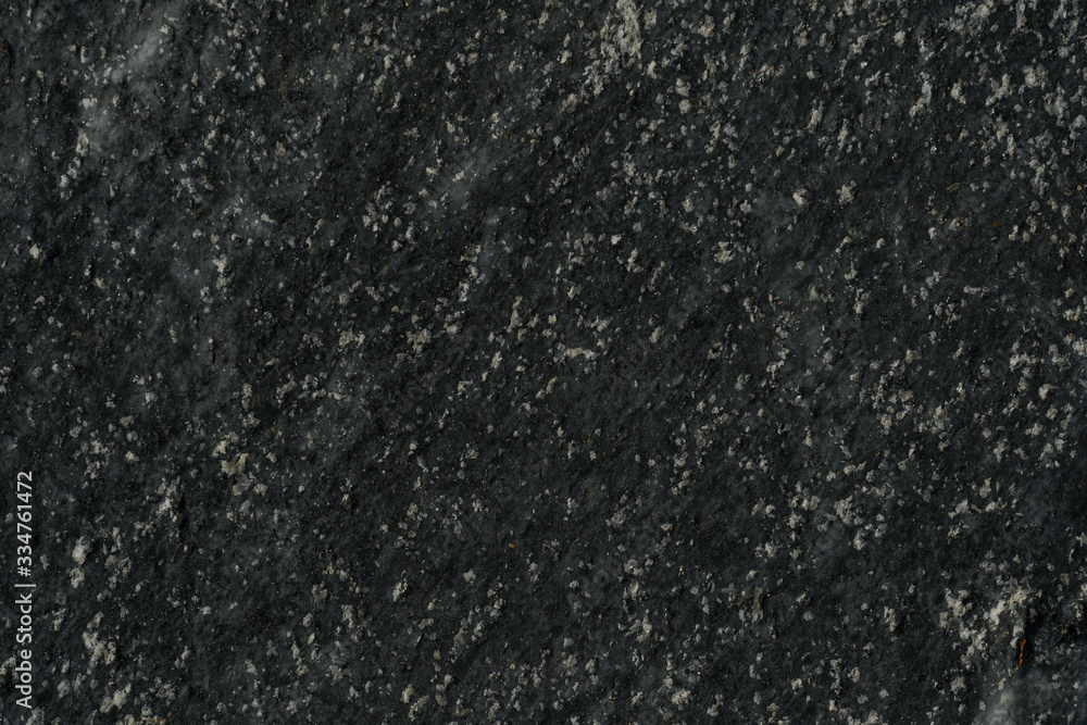 Texture wall of stone with dark grey and white tones