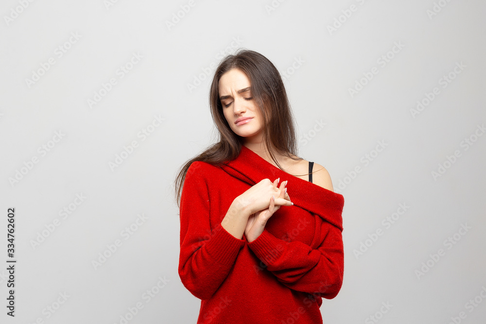 Portrait of a young woman looking bored, isolated on white-gray background Portrait of a young woman looking bored, isolated on white-gray background