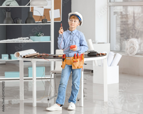 Cute little electrician in ...