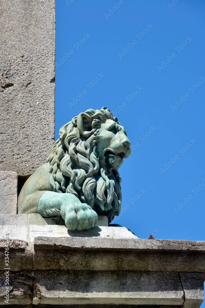 Lion head statue on the obelisk of Arles, a city and commune in the south of France