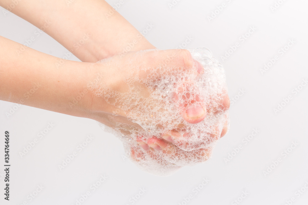 Closeup of children washing hands isolated. Cleanliness and body care concept. Global Handwashing Day Concept/Washing hands with soap Closeup of children washing hands isolated. Cleanliness and body care concept. Global Handwashing Day Concept/Washing hands with soap