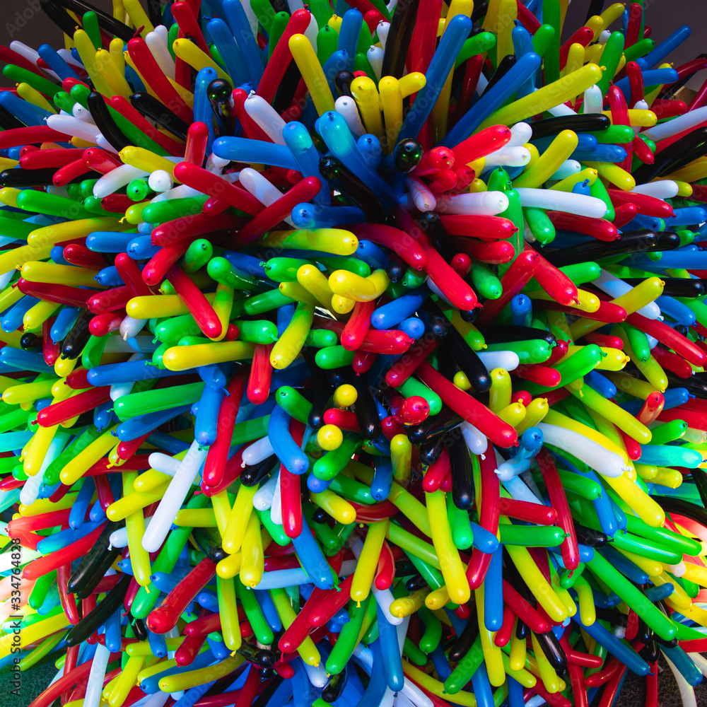 Fototapeta premium Background of multi-colored long balloons for a birthday party