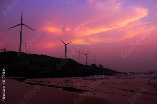 beautiful sunset beach magenta colorful sky windmill  long exposure  