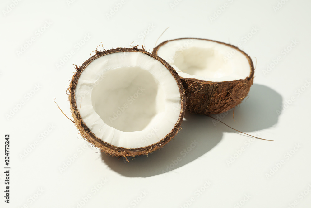 Halves of coconut on white background, close up Halves of coconut on white background, close up
