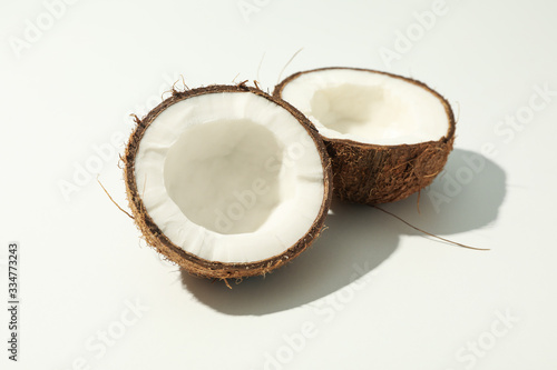 Halves of coconut on white background, close up
