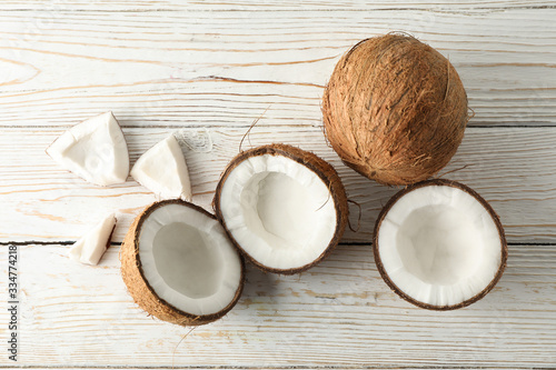 Fototapeta Naklejka Na Ścianę i Meble -  Coconut on wooden background, top view. Tropical fruit
