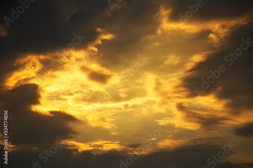 Beautiful stormy sunset sky. Cloudy abstract background. Sunset colors.