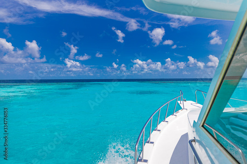 Beautiful view from front of yacht at seaward. Luxury lifestyle. Tropical sea transport, recreational boat vacation or snorkeling trip in Maldives or French Polynesia or Caribbean © icemanphotos