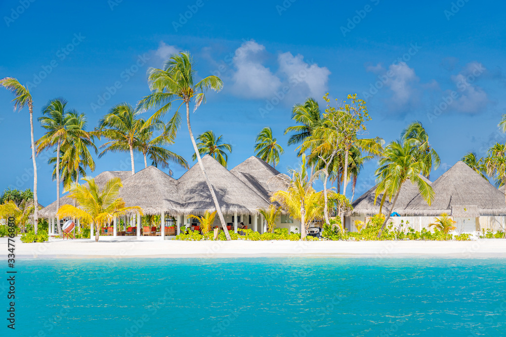 Beautiful beach with jetty at Maldives. Luxury travel, summer landscape with palm trees over blue tropical sea and white sand. Amazing beach landscape, tropical island resort and hotel, tranquil coast