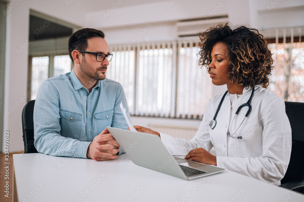 Meeting at doctor's office. Healthcare, medicine and people concept. Meeting at doctor's office. Healthcare, medicine and people concept.