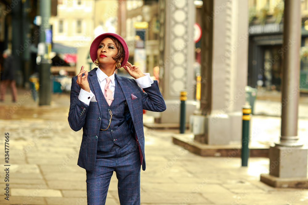 a young woman dressed in a tweed suit smoking a young woman dressed in a tweed suit smoking