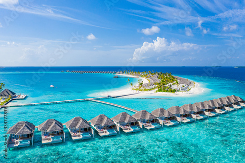Perfect aerial landscape, luxury tropical resort or hotel with water villas and beautiful beach scenery Fototapet