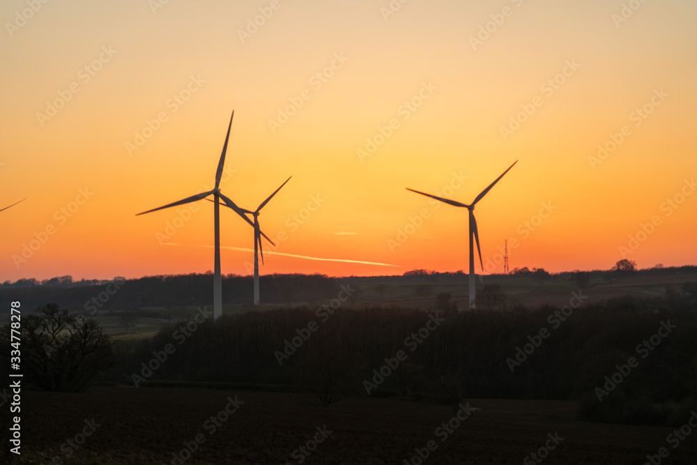 Wind turbines stationary at sunset Wind turbines stationary at sunset